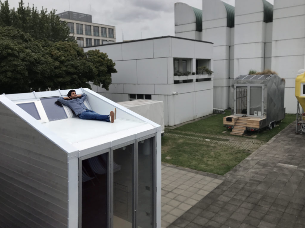 Leonardo Di Chiara relaxing on his own designed aVOID tiny house rooftop at Bauhaus Campus Berlin.